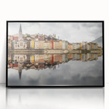 Large abstract wall art depicting a stylized Lyon cityscape in muted gray and blue tones, framed in black acrylic.