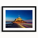 Abstract art print featuring vibrant, colorful depiction of a European scenery in a black frame, ideal for living room decor.