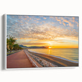 Vintage poster art of Nice, France, featuring colorful buildings; framed canvas in a white side view.