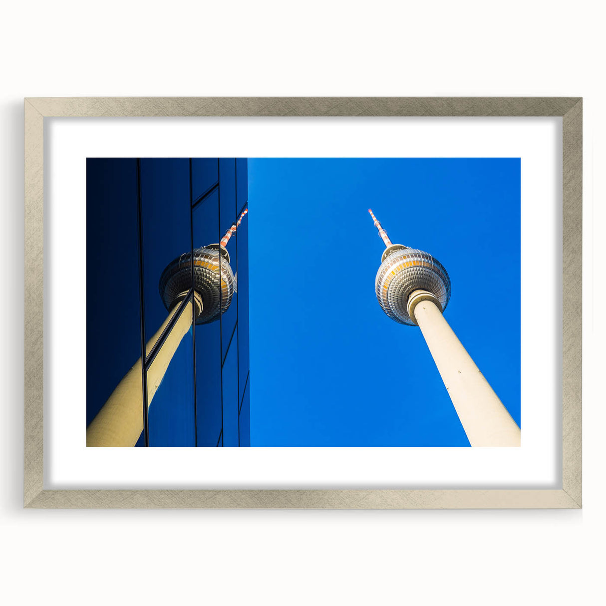 Extra large abstract art print of Berlin cityscape in textured grays and blues, framed in silver.