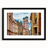 Extra large abstract art print depicting a colorful, textured Munich cityscape, set in a black frame with mat.