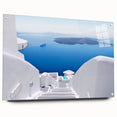 Acrylic print of Santorini with white buildings and blue domes, in muted blue and white tones, ideal for dining room art.
