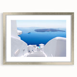 Extra large wall art depicting an abstract Santorini landscape in pastel shades on a framed silver mat.