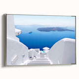 Framed canvas of a vintage-style Santorini landscape, with vibrant blue and white tones, ideal for living room decor.