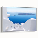 Vintage poster art of Santorini with vibrant blue and white tones on a framed canvas, suitable for living room decor.