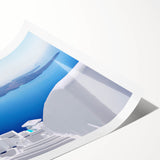 Extra large rolled print of Santorini scenery with line art flowers in muted blue and white tones.