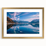 Abstract art print of a European Greenland scenery in muted green and blue tones, framed in gold.