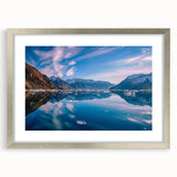 Extra large abstract art print of a Greenland scenery in muted green and blue tones, framed in silver.