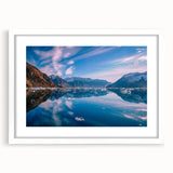 Textured art print of an abstract Greenland scenery in muted green and blue tones, framed with a white mat.