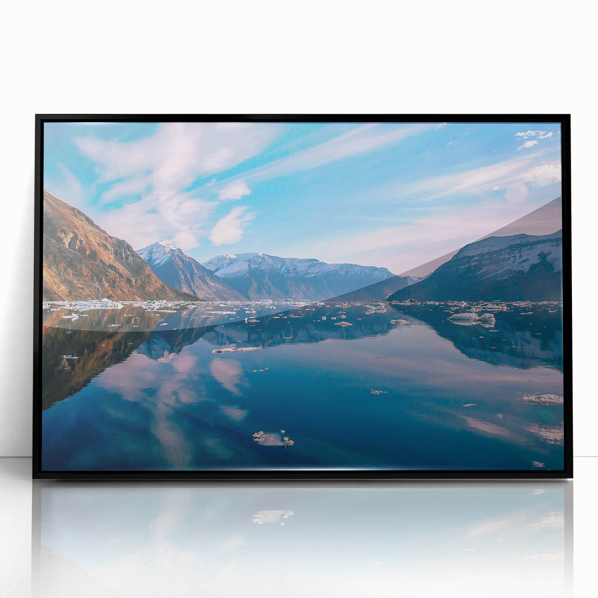 Large abstract wall art featuring a Greenlandic landscape in muted green and blue tones, framed in black acrylic.