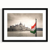 Extra large abstract art print featuring a colorful, textured depiction of a European scenery on a black framed canvas.