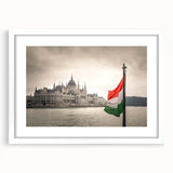 Textured abstract art print depicting a European scenery in muted earth tones, framed with a white mat.
