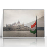 Mid-century modernist art depicting a European cityscape in muted blues and greens on a framed acrylic print.