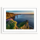 Textured abstract art print of a European scenery in muted green and blue tones, framed in white, ideal for bedroom art.