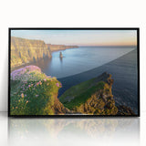 Large abstract wall art depicting a vibrant European Irish landscape in muted greens and blues, framed in black acrylic.