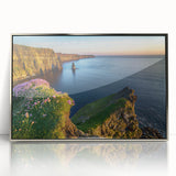 Large art print of a serene Irish landscape in muted green and blue tones, framed in silver acrylic.