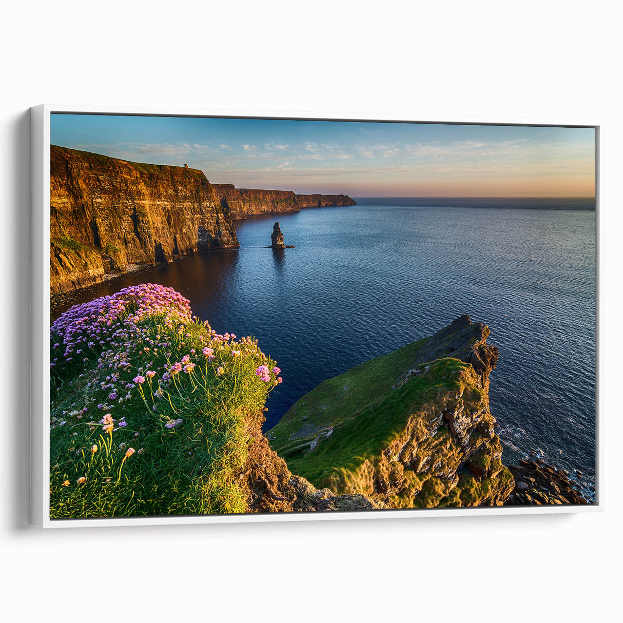 Vintage poster art of a scenic Ireland landscape on a framed canvas, with vibrant green and blue tones.