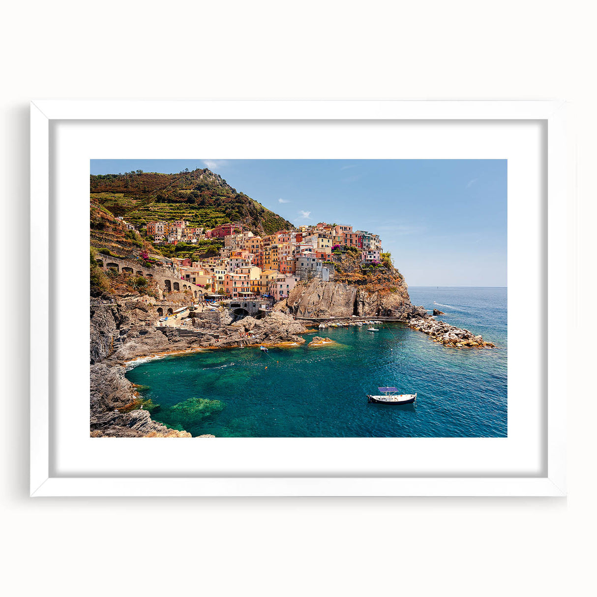 Textured art print depicting the Cinque Terre coast in muted earth tones on a framed white mat, suitable for bedroom art.