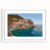 Textured art print depicting the Cinque Terre coast in muted earth tones on a framed white mat, suitable for bedroom art.