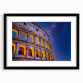 Colorful abstract art print of the Colosseum, featuring vibrant hues on a framed black mat, ideal for living room decor.