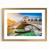 Abstract art print of Venice scene in muted gold and blue tones on a framed canvas, suitable for dining room decor.