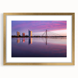 Abstract art print of a European landscape in muted gold and green tones, framed with a gold mat.