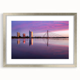 Extra large abstract art print of a textured European landscape in muted earth tones, framed in silver.