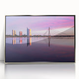 Large art print of a European Latvian landscape in muted green and blue tones, framed in silver acrylic.