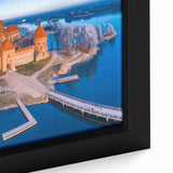 Extra large framed canvas of a textured black wall art featuring colorful, abstract European scenery.