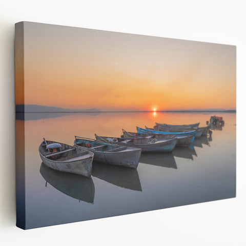 Large stretched canvas depicting a Mediterranean seaside town, in vibrant blues and whites, suitable for kitchen wall art.