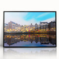 Large abstract wall art depicting Amsterdam scenery in muted gray and blue tones, framed in black acrylic.