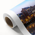 Art deco-style Amsterdam canal scene in muted blues and greens on a rolled canvas, ideal for nursery wall art.