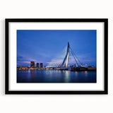 Abstract art print featuring a colorful, textured depiction of a European scenery, framed in black.