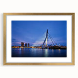 Abstract art print of a European scenery in muted earth tones on a gold-framed canvas, suitable for dining room decor.