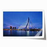 Rolled print of a European landscape with vibrant green fields and a windmill, perfect for dining room decor.