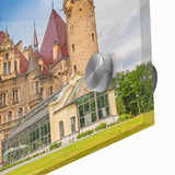 Large abstract wall art featuring a mid-century modernist depiction of a European scenery in muted earth tones.