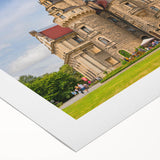 Art deco poster featuring a vibrant, stylized depiction of a European cityscape on rolled canvas.