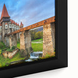 Black wall art featuring a textured, colorful Romanian landscape on a framed canvas.