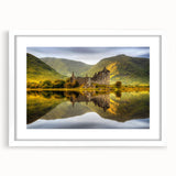 Textured art print of an abstract, muted color depiction of a Scottish landscape on a framed white mat.