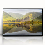 Large abstract wall art depicting a Scottish landscape in muted earth tones, framed in black acrylic.