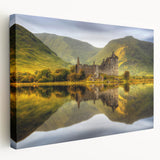 Landscape painting of Scottish highlands on stretched canvas, featuring muted green and blue tones.