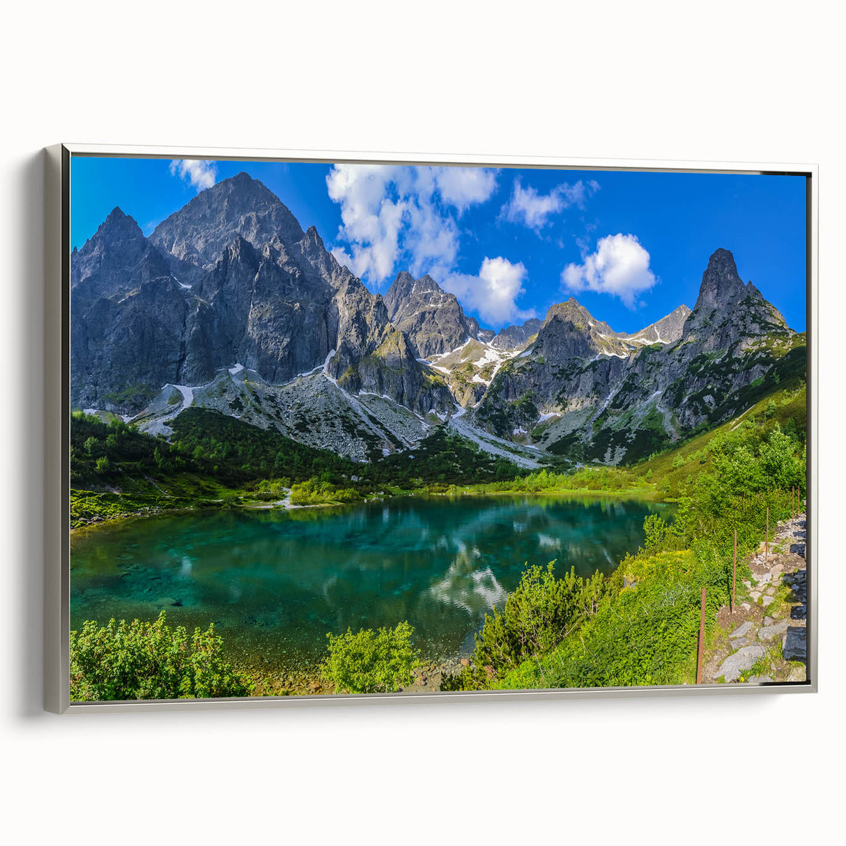Framed canvas landscape art painting of a European village in Slovakia, with muted colors and a vintage poster art style.