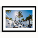 Abstract art print of a colorful, textured Spanish Canary Islands scenery on a large black-framed canvas.