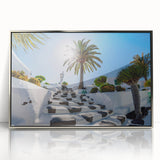 Large art print of a serene Canary Islands landscape in muted earth tones, framed in silver acrylic.