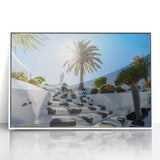 Mid-century modernist art depicting a serene European landscape in pastel shades on a white framed acrylic.