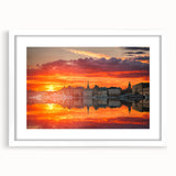 Abstract art print of Stockholm scenery in muted blue and gray tones on a framed white mat, suitable for dining room decor.