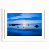 Abstract art print of a serene Swedish landscape in muted blue and green tones on a framed canvas.