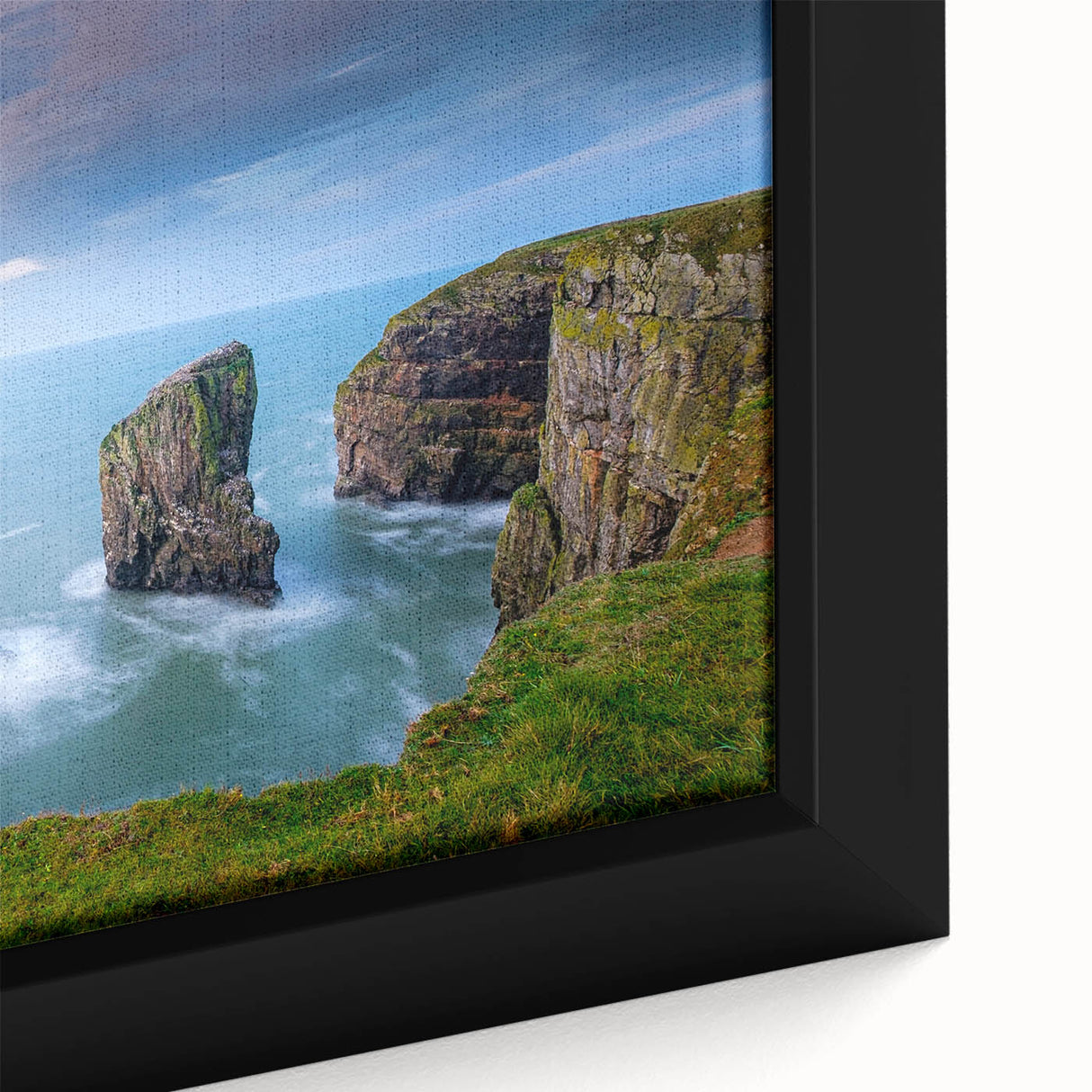 Black wall art featuring a textured, colorful depiction of a Welsh landscape on a framed canvas, ideal for living room decor.
