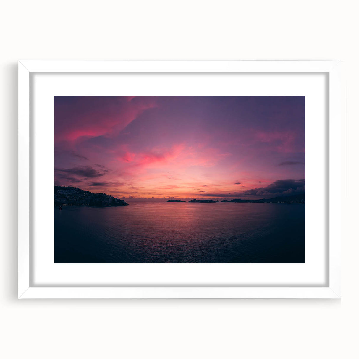 Abstract art print of Acapulco scenery in muted blue and green shades on a framed white mat, suitable for dining room decor.