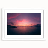 Abstract art print of Acapulco scenery in muted blue and green shades on a framed white mat, suitable for dining room decor.